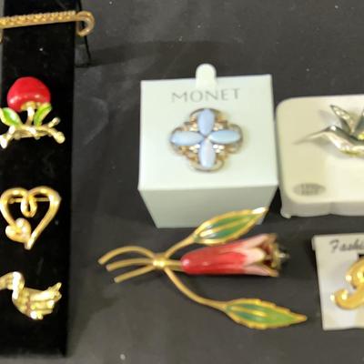 A Mixture Of Vintage And Newer Cosmetic Jewelry