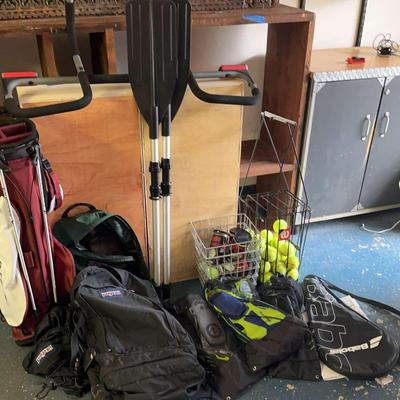 Variety Of Sports Equipment Including  Golf Club Caddy 