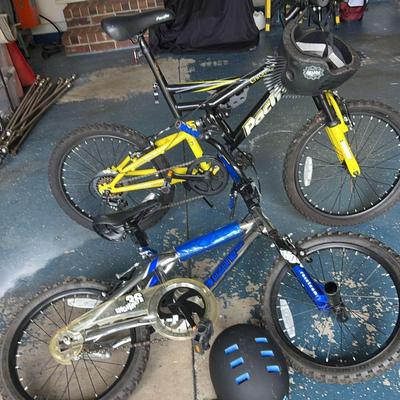 Two Kids BMX Bikes And Helmets 