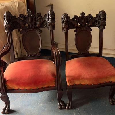 Pair of Ornately Carved Victorian-Style Chairs with Claw Feet and Wood Medallion Backs