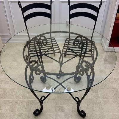 Round Glass Top Table With Two Metal Chairs