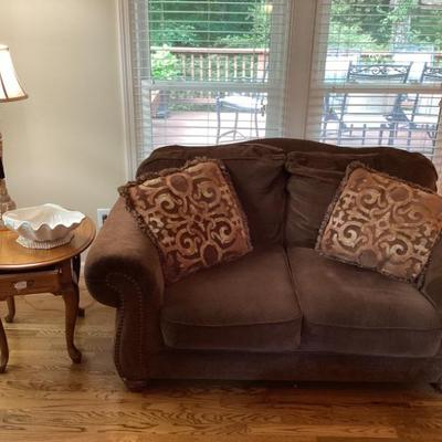 Brown love seat