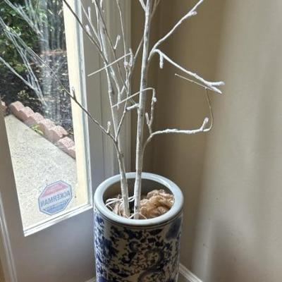 Floral urn with lighted tree