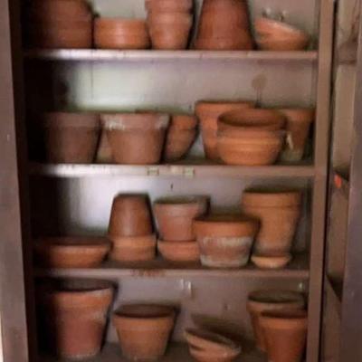 Lots Of Clay Pots And Cabinet 
