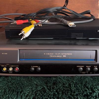Samsung Blueray Player And Panasonic VHS Player With Remotes And Cords
