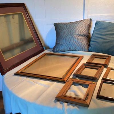 2 Pillows And An, Assortment Of Picture Frames