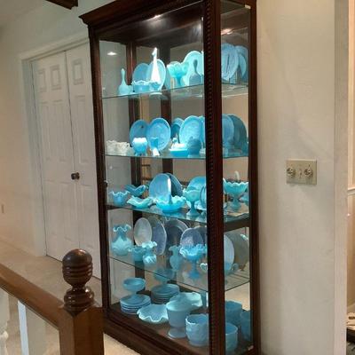 Howard Miller display case filled with Fenton