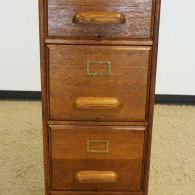 1096	UTILITY OAK 4 DRAWER FILE CABINET WITH PANELED SIDES, APPROXIMATELY 16 IN X 27 IN X 53 IN H
