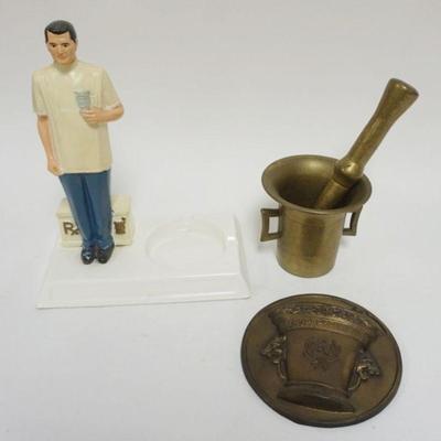 1065	GROUP OF PHARMAECUTIAL ADVERTISING, INCLUDING BRASS MORTAR AND PESTALE
