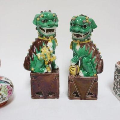 1041	GROUP OF ASSORTED ASIAN POTTERY FOO DOGS, APPROXIMATELY 10 IN HIGH & PORCELAIN VASE & COVERED JAR
