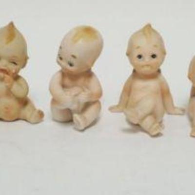 1027	GROUP OF BISQUE KEWPIE FIGURES, TALLEST APPROXIMATELY 5 IN HIGH
