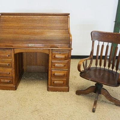 1095	DIMINUATIVE OAK ROLL TOP DESK WITH PANELED SIDES AND FOLD OUT WINGS AND DESK CHAIR, CHAIR HAS 1 DAMAGED RAIL, APPROXIMATELY 50 IN X...