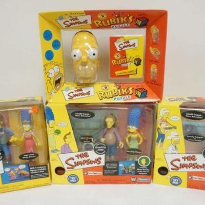 1152	THE SIMPSONS PLAYMATES FIGURES AND RUBIKS CUBE UNOPENED
