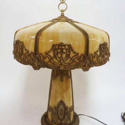 1001	ORNATE ANTIQUE SLAG GLASS TABLE LAMP, METAL IMAGES OF WINGED GRIFFINS & WOMAN BUST, INTERIOR LIT SLAG GLASS BASE, CURVED SLAG...