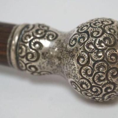 1007	STERLING SILVER TOP WALKING STICK, SOME DENTS TO TOP, APPROXIMATELY 36 IN
