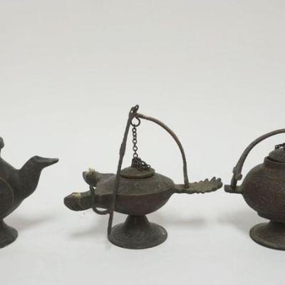 1043	GROUP OF BRONZE OIL LAMPS, LARGEST APPROXIMATELY 8 IN
