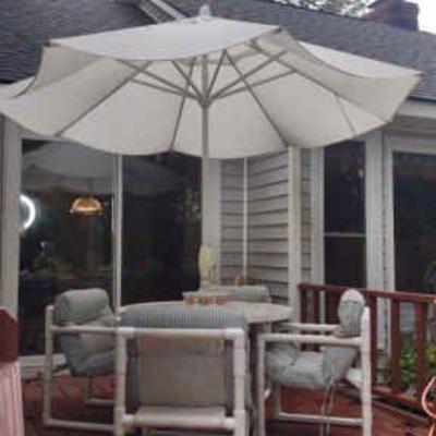 Table with umbrella and chairs