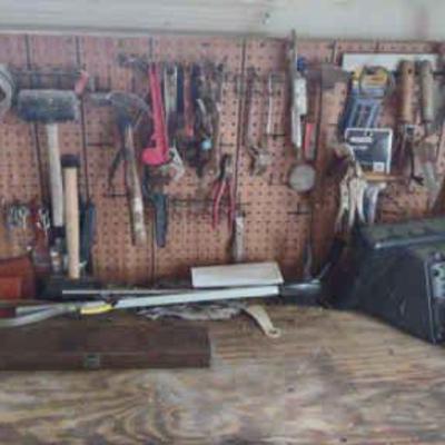 Workbench and pegboard of tools
