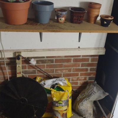 Flower pots, soil and squirrel deflectors