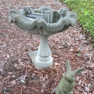 Bird bath and concrete rabbit