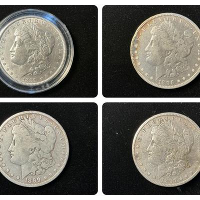 Four Morgan Silver Dollars (C33)