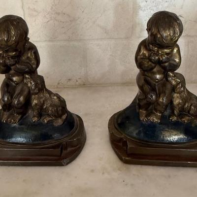 J L Drucklieb giggling child with dog bookends  