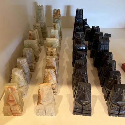 Carved green and black onyx chess set 