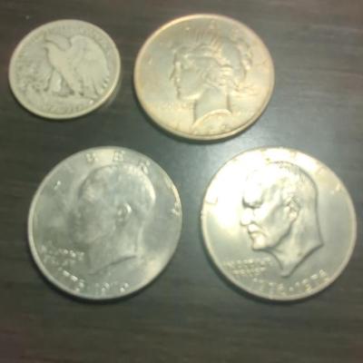 Two 1976 Eisenhower Silver Dollars, 1922 Peace Dollar, 1943 Half Dollar