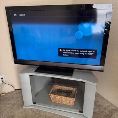 Sony Bravia 46” LCD TV + Swiveling Glass Door TV Stand & Basket	