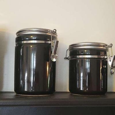 Four black Graduated Kitchen Canisters