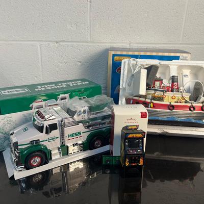 Collectible Toys: Hess 2019 Tow Truck, Lemax Salty Tugboat, Hallmark Defender Arcade, With Boxes