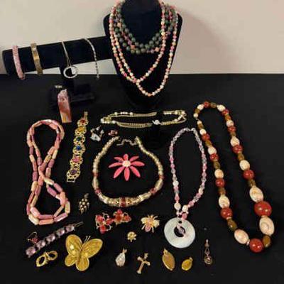 Costume jewelry in berry tones