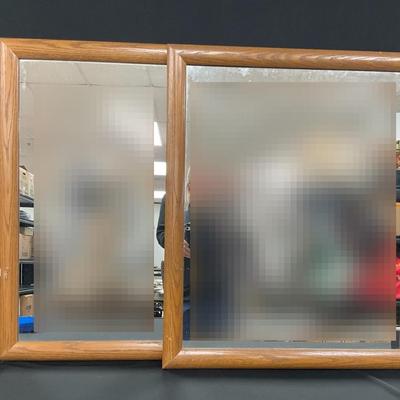 Two Identical Mirrors In Wooden Frames