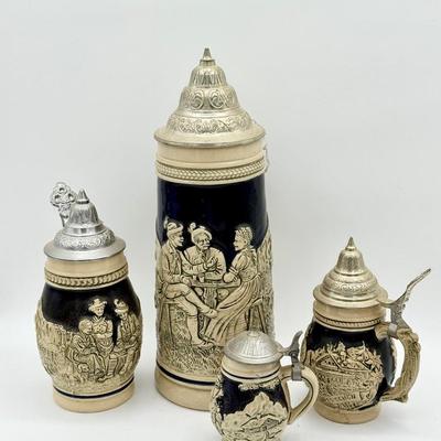 (4) German Relief Beer Steins with Pewter Lids – DBGM Marked