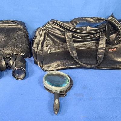 Tasco Binoculars (1), Carson Magnifying Glass (1) + Lucas Black 
Leather Bag (1)