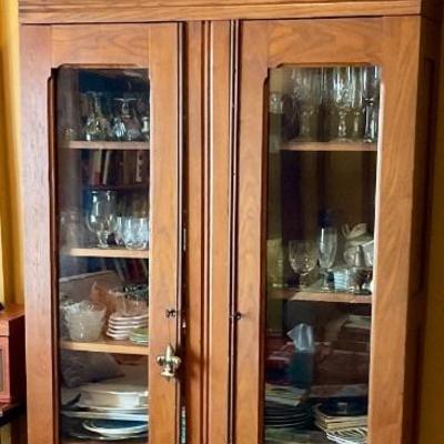 Glass front armoire, filled with crystal and smalls