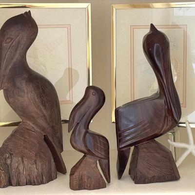 Three Interpretations Of Carved Ironwood Pelicans 