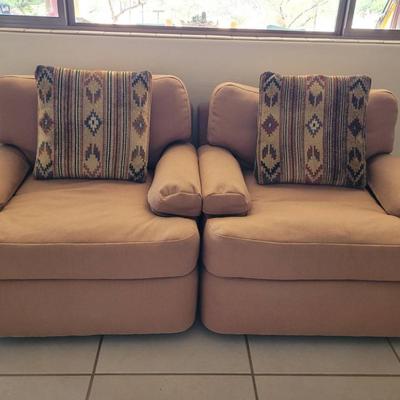Two Tan Swivel Chairs