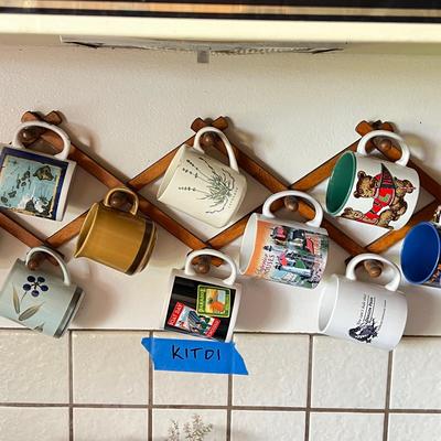 Eclectic Collection of Mugs and Vintage Wall Rack