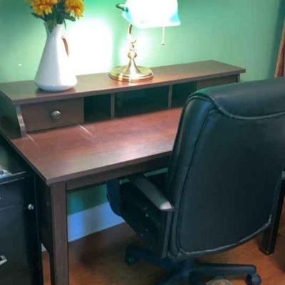 Desk chair, desk lamp and florals