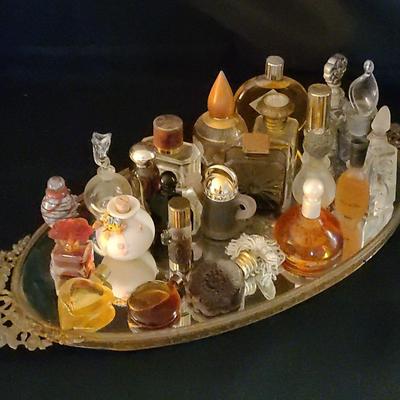 Mirrored Vanity Tray With A Variety Of Vintage Perfume Bottles Atop