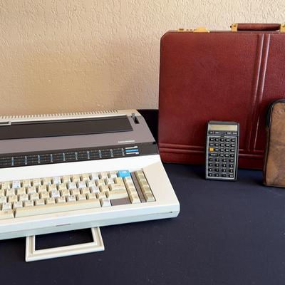 1980s business world! - Royal typewriter, HP calculator and briefcase 
