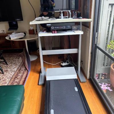 Treadmill with adjustable height desk.