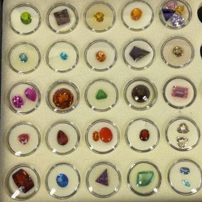 Assorted Faceted Gemstone Collection in Display Case