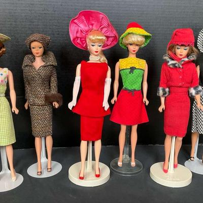 Vintage Barbie Dolls in Colorful Dresses and Hats