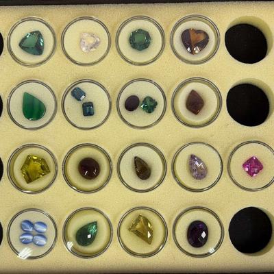 Assorted Loose Gemstone Collection in Display Case 