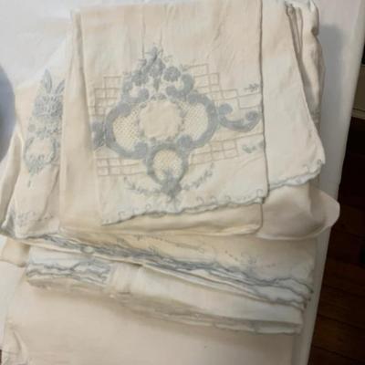 lots of antique and vintage linens and fabrics