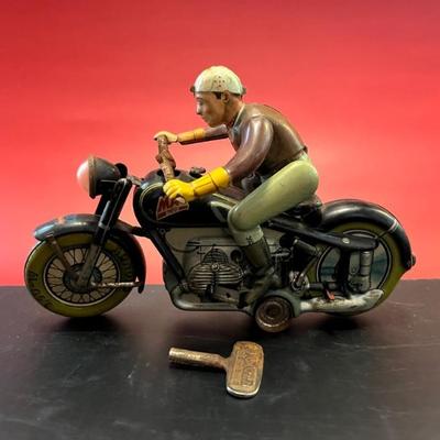Vintage tin lithographed motorcycle toy, still works