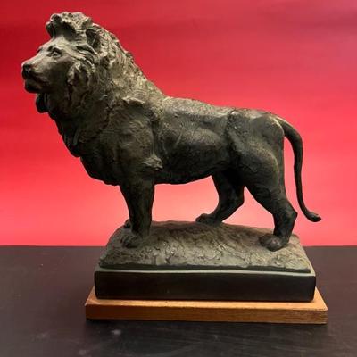 An Art Institute of Chicago lion replica mounted on wood