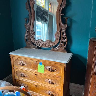 Victorian 3 drawer dresser with marble top and a mirror, also has a matching night table